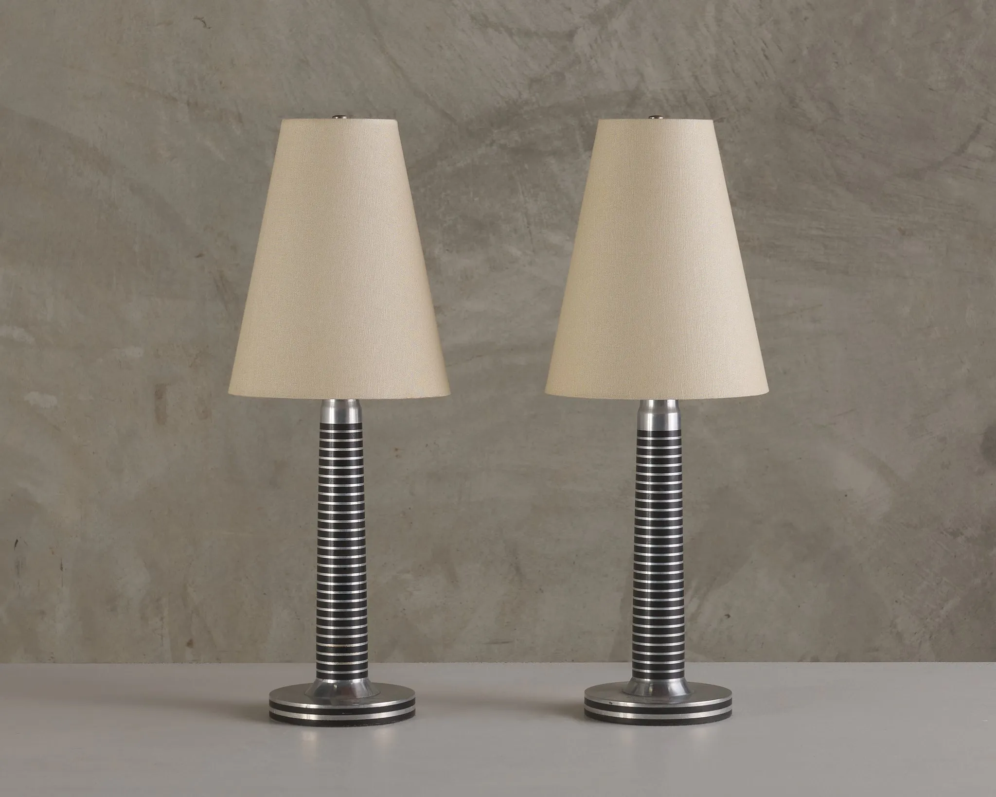 PAIR OF MACHINE AGE ALUMINUM LAMPS